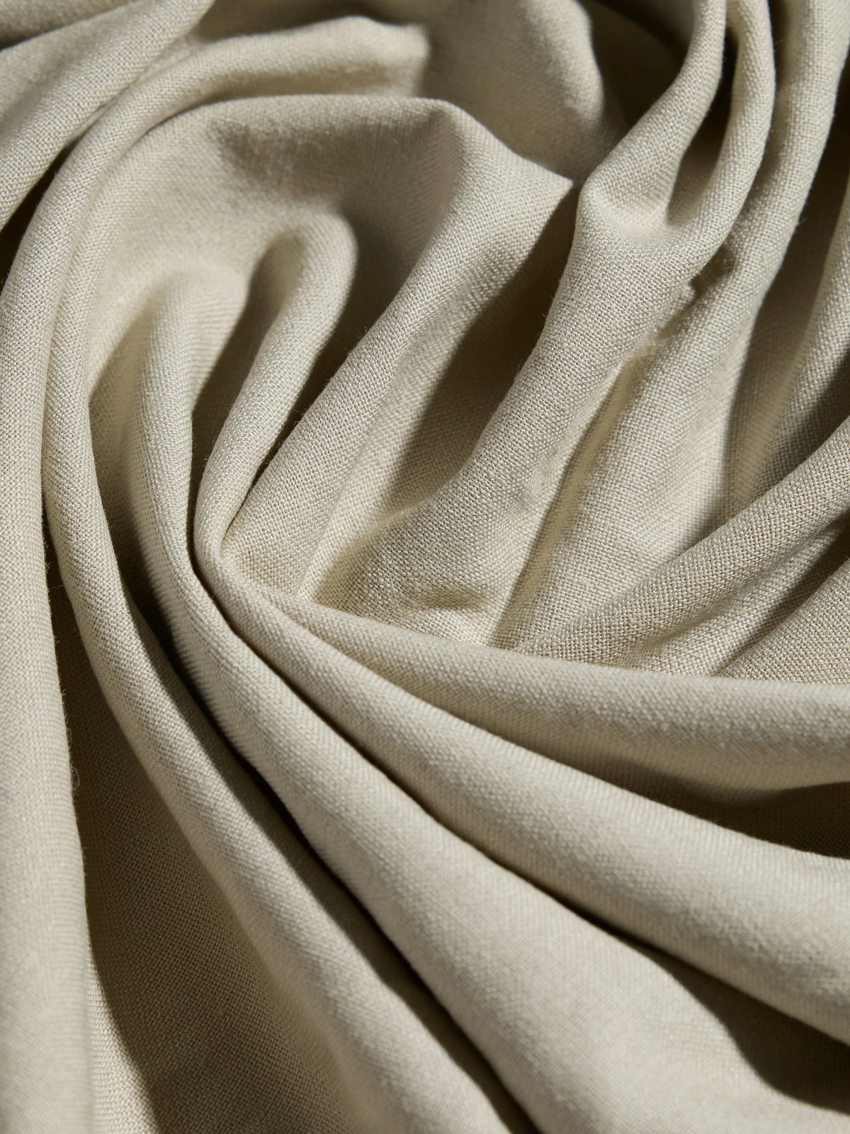 Close-up of sage green linen fabric texture